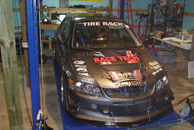 APR PERFORMANCE CARBON FIBRE FRONT WIND SPLITTER W/RODS